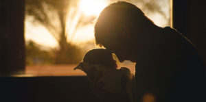 Beneficiaries Special Needs - photo of man holding a newborn infant